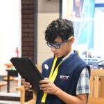 JA BizTown citizen working on tablet