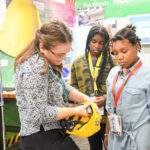 Volunteer helping JA BizTown citizens