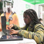 JA BizTown citizen working on a laptop